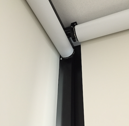 closeup of butting back rolling blockout blinds in an office environment