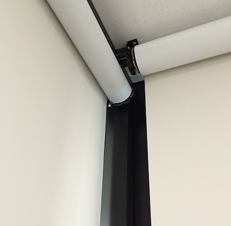 closeup of butting back rolling blackout blinds in an office environment