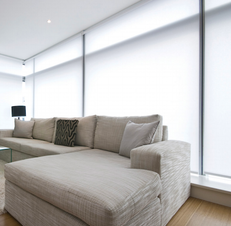 soft diffused light created by sheer roller blinds in the lounge of a new home