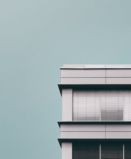 view of an apartment building with aluminium blinds