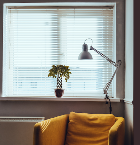 white aluminium blind in an apartment lounge