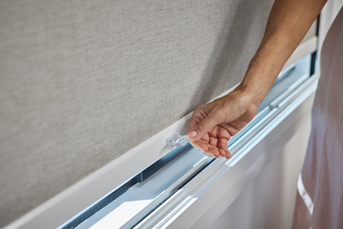 Close-up of SmartBlock blackout blind handle for smooth bottom rail operation