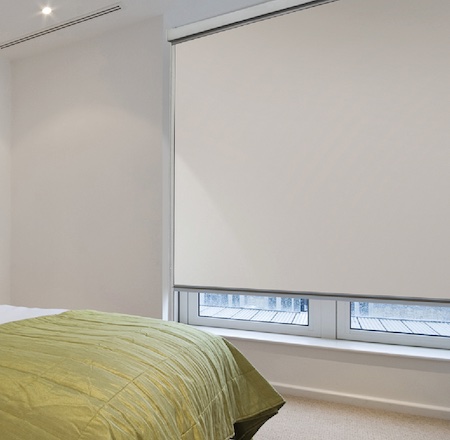 SmartBlock blackout blind system installed in master bedroom with cassette, side channels, and bottom rail for total light blockout